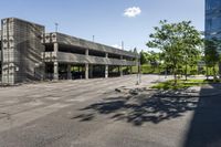 a view of the empty parking lot outside of a building with no people on it