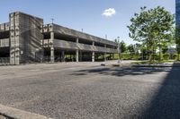 a view of the empty parking lot outside of a building with no people on it