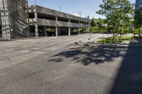 a view of the empty parking lot outside of a building with no people on it