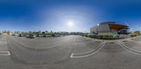 the 360 - view of the empty parking lot in front of an office building with its light shining on