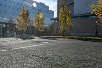 the empty parking lot in front of the school building with blue dots on it is empty