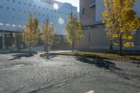 the empty parking lot in front of the school building with blue dots on it is empty