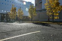 the empty parking lot in front of the school building with blue dots on it is empty