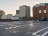 an empty parking lot with cars parked outside it at sunset in the city of new york, usa