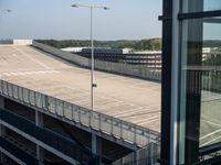 an empty parking lot next to the highway has been converted into a pedestrian walkway for pedestrians