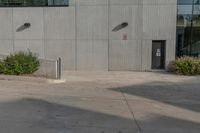 the parking meter is empty in front of the building building that has no parking meters on it