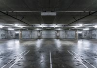 empty parking space with lights, parking spaces and concrete walls have been changed to give this photo look a much grungy feel