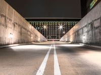 this image shows an empty parking space on the side of a bridge next to some buildings