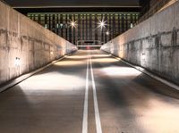 this image shows an empty parking space on the side of a bridge next to some buildings