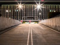 this image shows an empty parking space on the side of a bridge next to some buildings