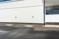 a empty parking space with a blue sky and some trees in the background for urban purposes