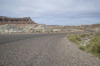 an empty paved highway in a barren, mostly barren area in the wild side of the country