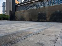 the empty public square has some light reflected on it, and no one is in