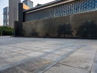 the empty public square has some light reflected on it, and no one is in