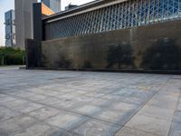 the empty public square has some light reflected on it, and no one is in