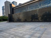 the empty public square has some light reflected on it, and no one is in