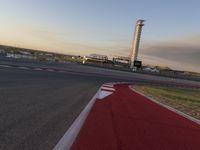 a race track is empty and ready to be ridden down into the air at dusk