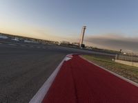 a race track is empty and ready to be ridden down into the air at dusk