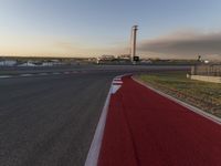 a race track is empty and ready to be ridden down into the air at dusk