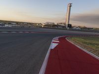 a race track is empty and ready to be ridden down into the air at dusk