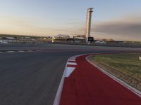 a race track is empty and ready to be ridden down into the air at dusk