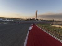 a race track is empty and ready to be ridden down into the air at dusk