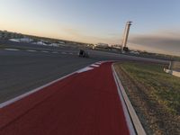 a race track is empty and ready to be ridden down into the air at dusk