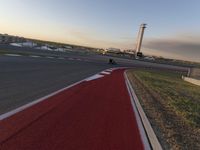 a race track is empty and ready to be ridden down into the air at dusk