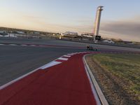 a race track is empty and ready to be ridden down into the air at dusk