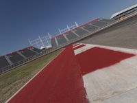 an empty racetrack with the track painted red and white stripes for racing teams to practice