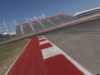 an empty racetrack with the track painted red and white stripes for racing teams to practice