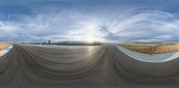 a 360 - view photo of an empty skateboarder coming down the slope on his skate board