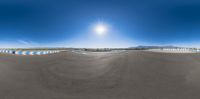 an empty road with many lanes under it in the sky is shown at sunset and is mostly blurry