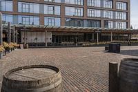 the sidewalk outside of an empty restaurant on a sunny day in the city of boston