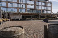 the sidewalk outside of an empty restaurant on a sunny day in the city of boston