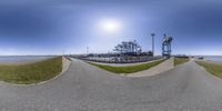 two panoramic pictures of one empty road and another image with an asphalt road running in the same direction