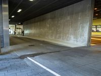 an empty area that has no traffic, but people are waiting at the side walk