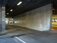 an empty area that has no traffic, but people are waiting at the side walk