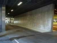 an empty area that has no traffic, but people are waiting at the side walk