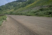 an empty road with a mountain in the backrouch, which is not quite visible