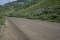 an empty road with a mountain in the backrouch, which is not quite visible