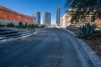 the empty road near the city is empty but not very busy enough for people to walk or ride on