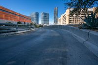 the empty road near the city is empty but not very busy enough for people to walk or ride on