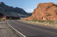 the road in the middle of the desert is empty and looks like it can be taken off the car