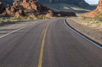 the road in the middle of the desert is empty and looks like it can be taken off the car