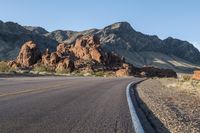 the road in the middle of the desert is empty and looks like it can be taken off the car