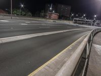 the street is empty and empty of people to see as the traffic goes by at night