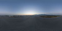 an empty tarp fence at sunset with view to the mountains in the background -