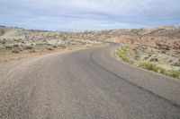 a view of an empty road with no traffic in it, which is very barren