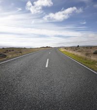Empty Road with Vertical Rock Wall: A Unique POV Experience